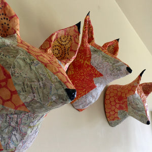 Fox sculpture made from topo maps of Montana, recycled paper and batik fabric. Upcycled and recycled materials. one of a kind, made in Montana.